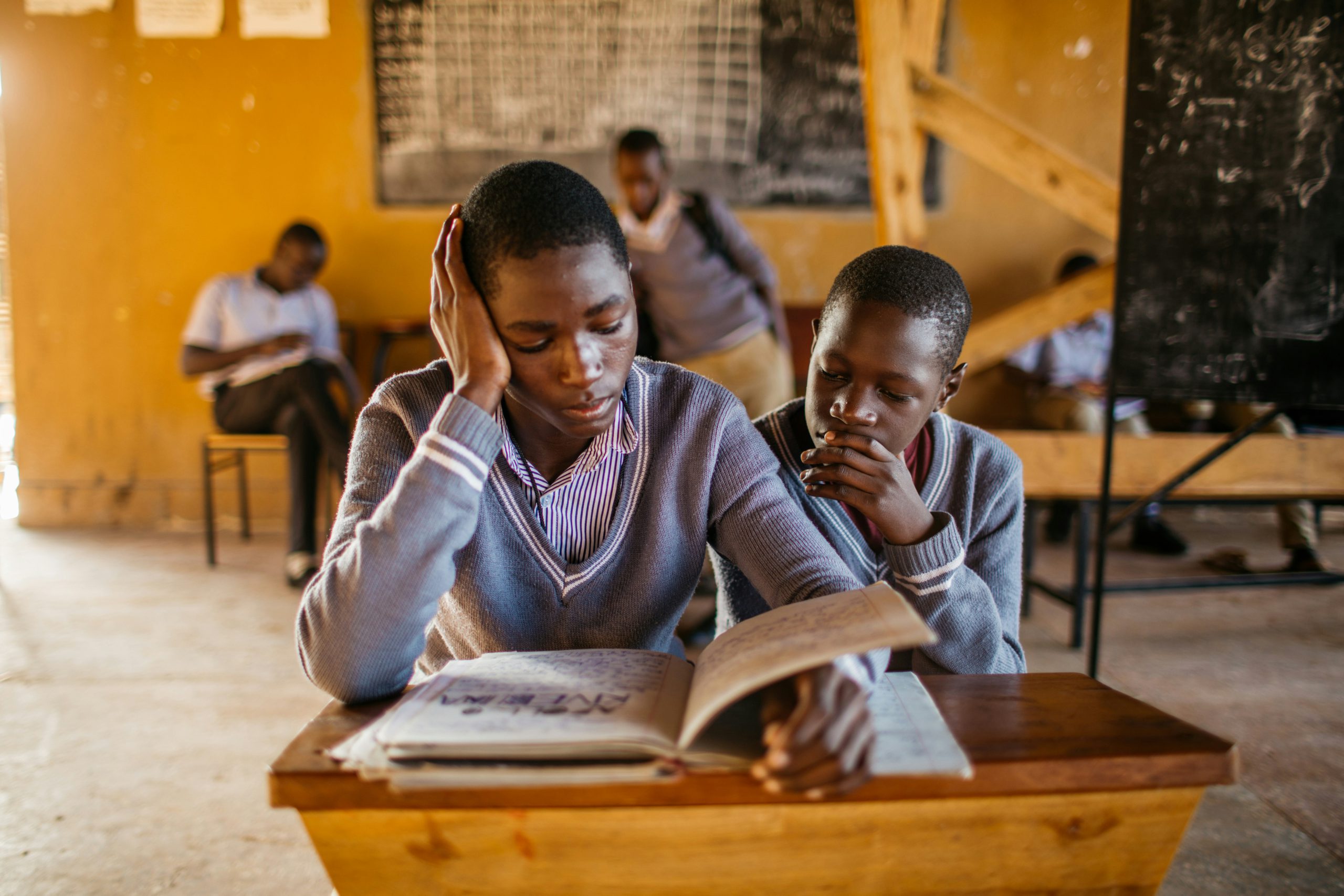 Young students learning together at a desk